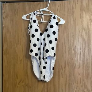 White polka dot one piece swimsuit with plunge neck